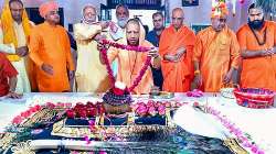 RSS chief Mohan Bhagwat and UP CM Yogi Adityanath offer prayers at the samadhi of Baba Mastnath in Rohtak.