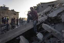 A helpless man sitting on the rubles after losing his family in Israeli bombardment in Gaza. 