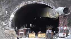 Security forces personnel guard as rescue work continues after a portion of an under-construction tunnel between Silkyara and Dandalgaon on Brahmakhal-Yamunotri national highway collapsed in Uttarkashi district