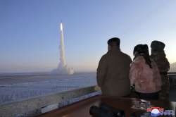 North Korean Supreme Leader Kim Jong Un watching the missile launch.