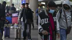 Passengers moving out of Mumbai airport.