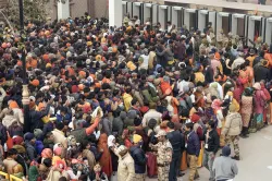 Devotees wait in queues to undergo security checks to enter the Ram temple in Ayodhya on Tuesday