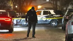 Policeman inspecting the crime scene in Chicago.