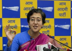 Delhi Minister Atishi addresses a press conference on ED raids, in New Delhi.