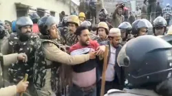 Security personnel at the site after a group of protestors hurled stones and set vehicles on fire, over the demolition of an "illegally built" madrasa at Banbhoolpura area, in Haldwani, Uttarakhand.