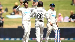 Rachin Ravindra celebrates a dismissal with Tom Blundell.