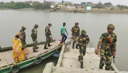 Security personnel conduct a route march at Sandeshkhali in North 24 Parganas