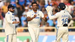 Ravichandran Ashwin celebrates a wicket with Dhruv Jurel and Rohit Sharma.