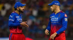 Virat Kohli having a conversation with Faf du Plessis.