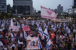 Thousands rally in Tel Aviv demanding new elections and the resignation of PM Benjamin Netanyahu