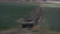 Israeli Defense Forces tank drives away from Gaza  Strip. 