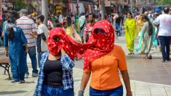 People cover themself with clothes to protect themselves from heatwave