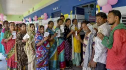 Voters standing in queue to cast their vote in the Lok Sabha elections 2024.