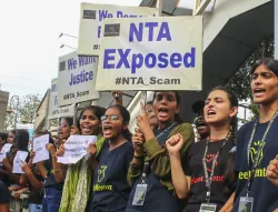 Students raise slogans during a protest over the alleged irregularities in NEET 2024 results