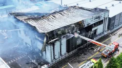 Firefighters work at the site of a burnt lithium battery manufacturing factory in Hwaseong, South Ko