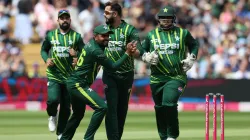 Imad Wasim celebrates a wicket with Babar Azam.