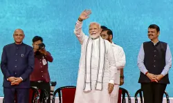 Prime Minister Narendra Modi waves to the crowd during an event in Mumbai