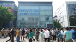 Security personnel stand guard near a UPSC exam coaching centre