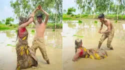 Couple performs 'Naagin' dance in muddy fields 