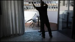 People examine the damage caused by the explosion in Tel Aviv.