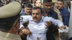 BJP leader Sunil Kumar being detained by police during a protest march by the BJP against alleged corruption by the ruling Congress government, in Bengaluru.