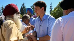 Canada's Prime Minister Justin Trudeau greets community members in Holland park, in Surrey