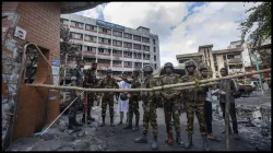 Bangladesh Army personnel stand guard in front of Jatrabari Police Station.