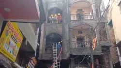 Fire brigade officials at the building that catches fire