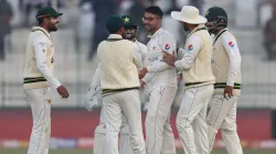 Abrar Ahmed celebrates a wicket with his teammates.