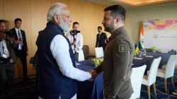 Ukraine President Volodymyr Zelenskyy, right, and Prime Minister Narendra Modi meet at the Grand Pri