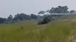 A screen grab from the video shows an IAF helicopter making an emergency landing in a waterlogged area.



