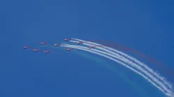 Indian Air Forces aerobatics team Surya Kiran performs during an air show as part of the 92nd anniversary celebrations of IAF at Marina Beach in Chennai. 