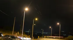 Cars move on a road as projectiles launched from Iran are being intercepted in the skies over the northern Israel.