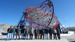 Officials pose for a photo click at the site of the imaging telescope MACE 