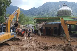 Rescuers search for victims after a landslide that killed a number of people and left some others mi