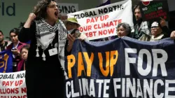 Activists participate in a demonstration for climate finance at the COP29 UN Climate Summit