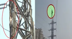 Man is seen doting stunt on the tower