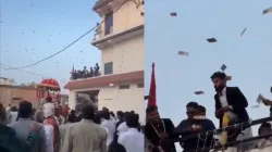 Family and Guests showering bundles of notes at the wedding procession in Uttar Pradesh's Siddhartnagar. 