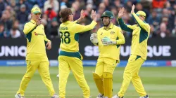 Adam Zampa celebrates a wicket with Josh Inglis and his other teammates.