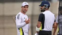 India's assistant coach Ryan ten Doeschate having a word with Virat Kohli during a net session.