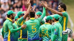 Mohammad Irfan celebrates a wicket with his teammates.