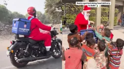 Delivery executive dressed as Santa offers food to underprivileged kids