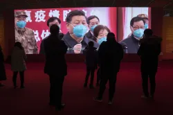 People attend an exhibition on the city's fight against the coronavirus in Wuhan in central China's 