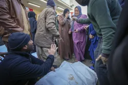 Relatives mourn as the bodies of victims from overnight Israeli army strikes at multiple locations in the central Gaza Strip are laid together for funeral prayers, at Al-Aqsa Martyrs Hospital in Deir al-Balah.