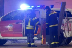 Rescue workers work at the site of a shooting in Cetinje, 36 kilometers west of Podgorica, Montenegro