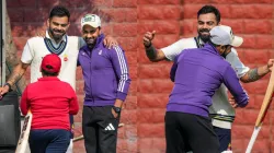 Virat Kohli with his friend Shawej Khan and his son Kabir during net sessions at the Arun Jaitley Stadium on Tuesday, January 28