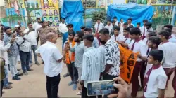 Students and parents protest outside the school. 