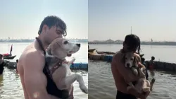 Internet reacts after man takes holy dip with pet dog