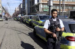 A police officer secures a street in the city center of Mannheim after a car rammed into a crowd  