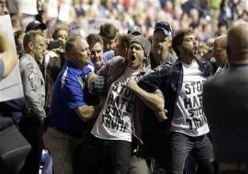 Protesters are removed during the rally